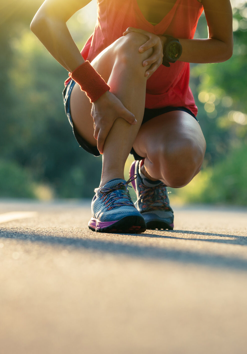 Woman runner got sports injury running on forest trail